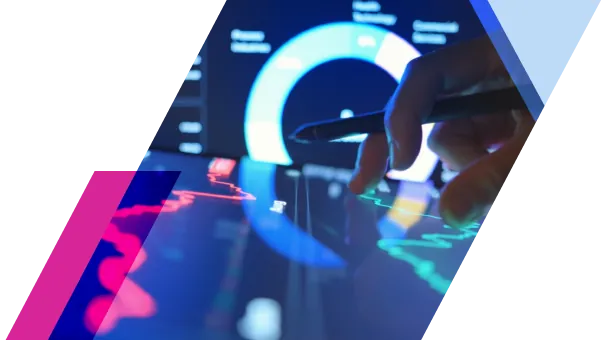 Hand using stylus on digital tablet with financial graphs, blue and red charts. Data analysis in progress.