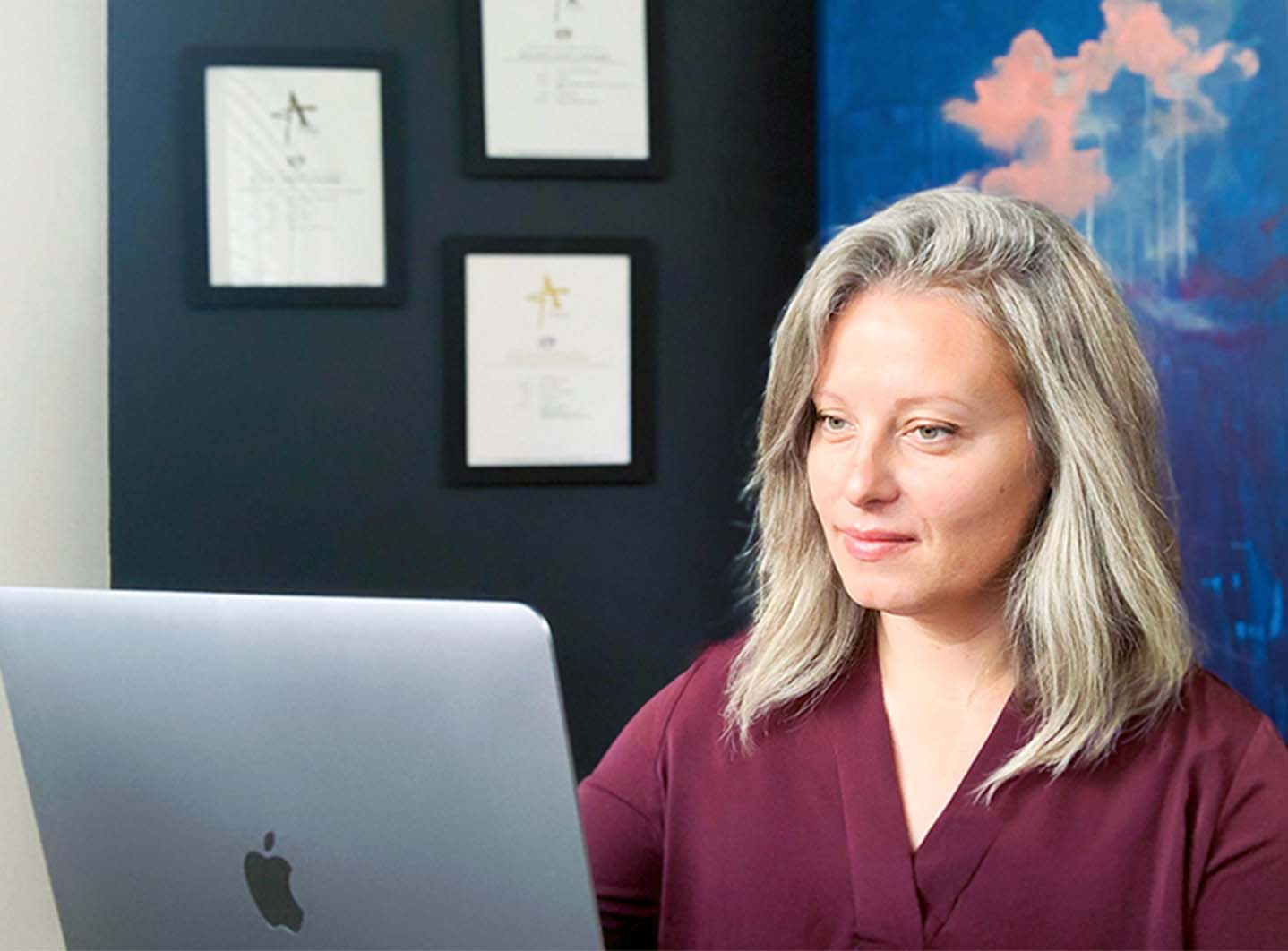 A designer using her desktop computer