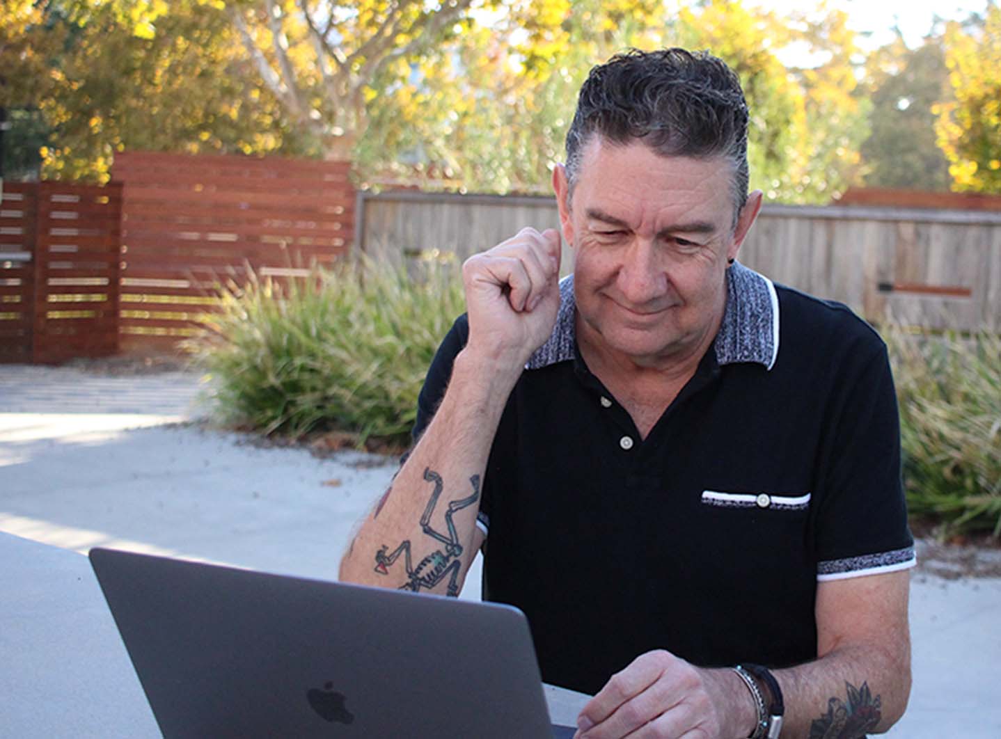 A business professional using his laptop